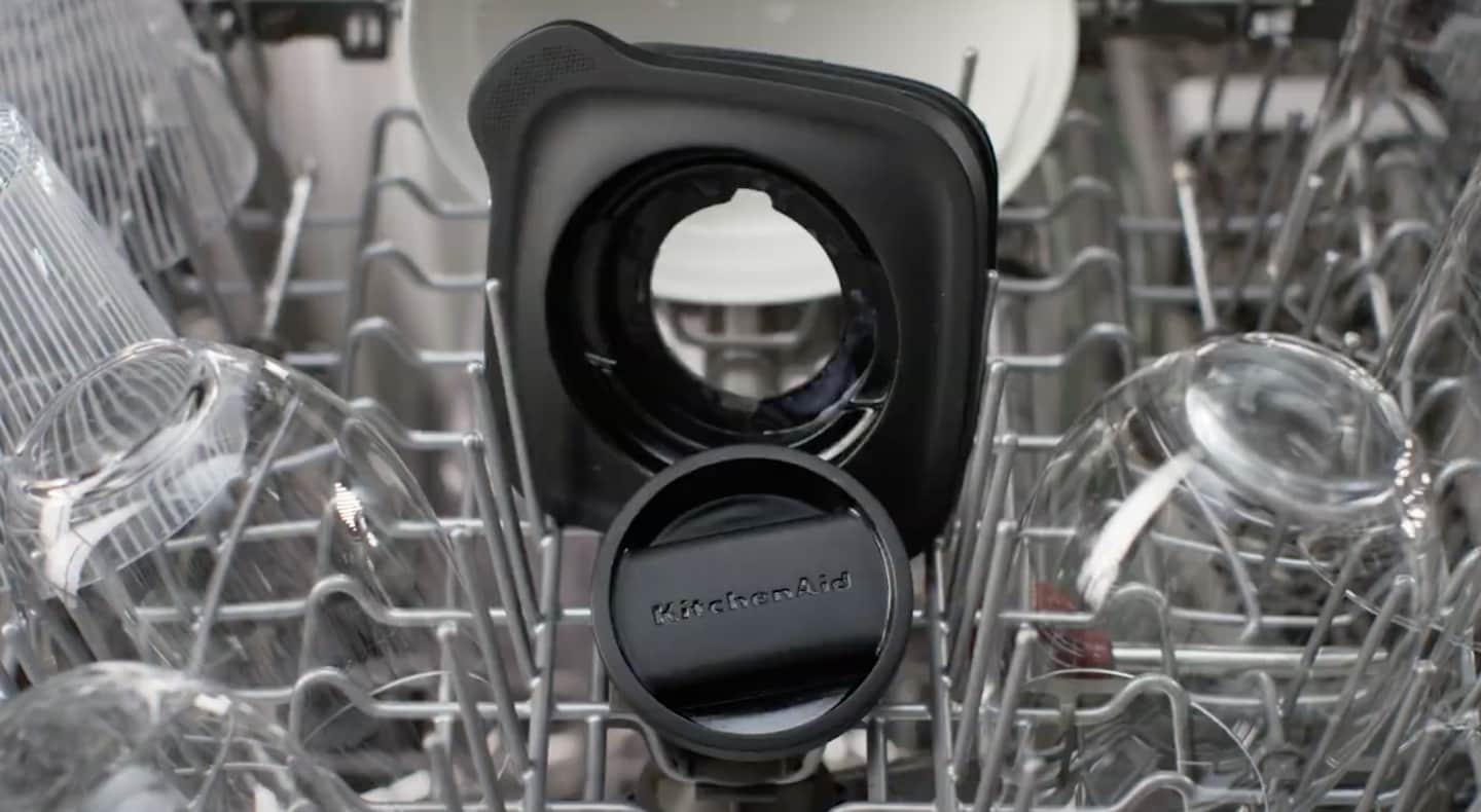 Black KitchenAid® blender lid and top on dishwasher rack Black KitchenAid® blender lid and top on dishwasher rack